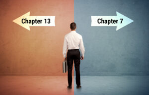 salesman-in-doubt-standing-in-front-of-two-arrows-2025-10-13-12-52-29-utc | Baltimore Bankruptcy Lawyer Conversion Between Bankruptcy Chapters